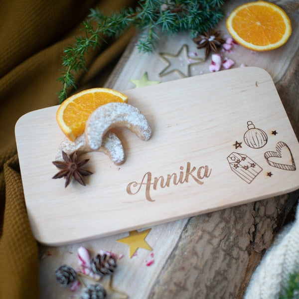 Brettchen mit Weihnachtselementen aus Buche